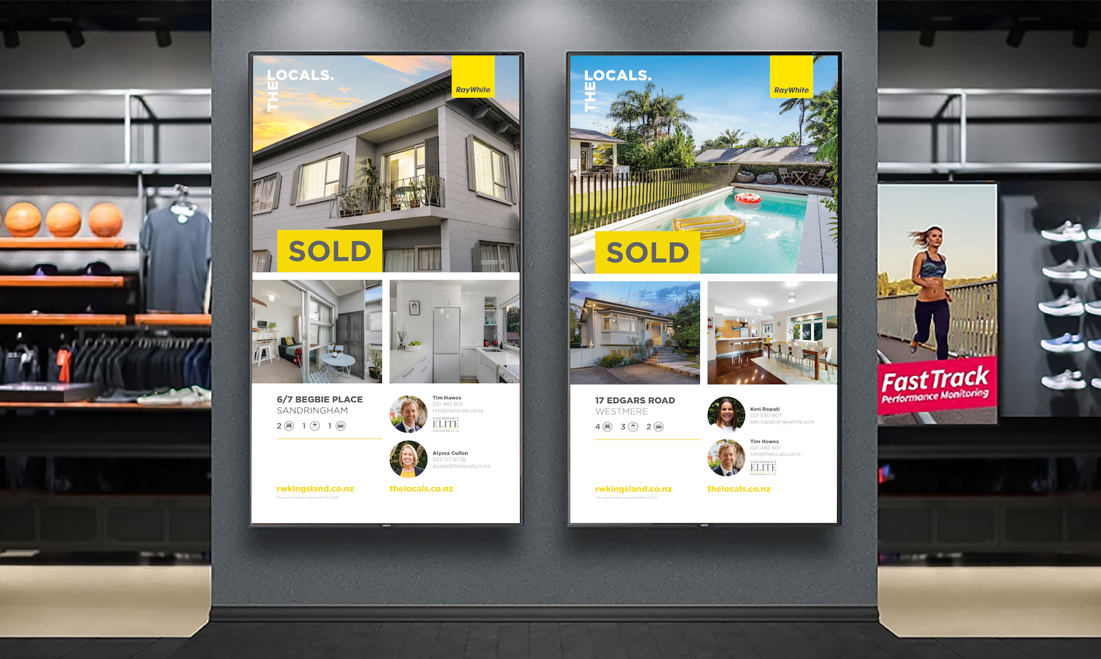 Two vertical digital signage displays showcasing real estate advertisements with Sold banners, placed on a wall in a retail environment near sports clothing and equipment.