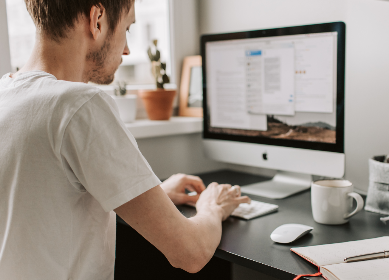 Man on computer at desk