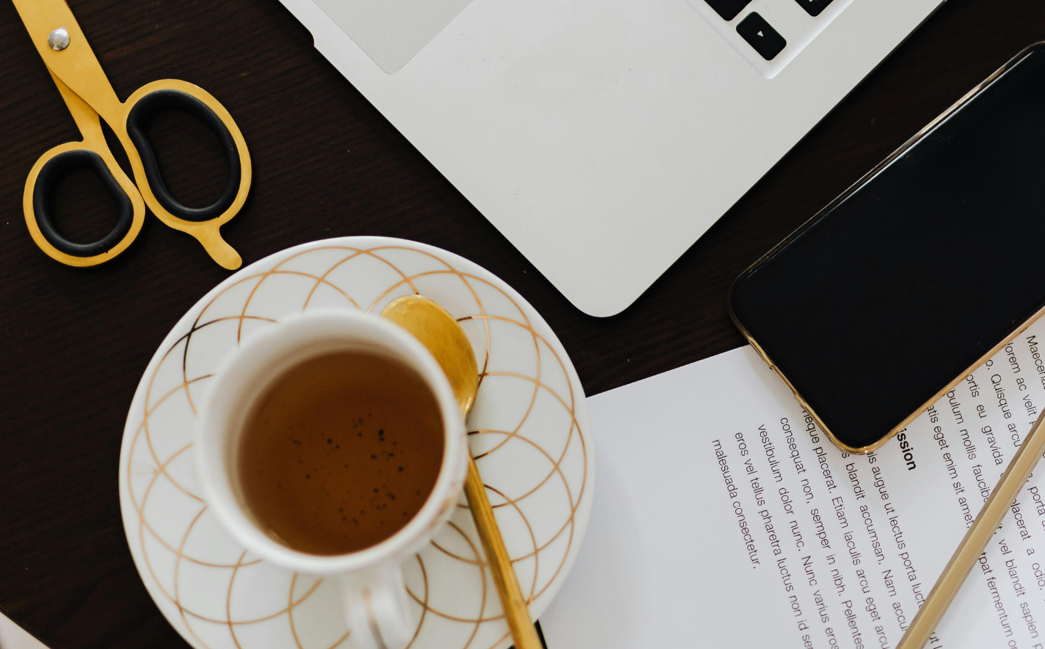 smartphone on table with coffee