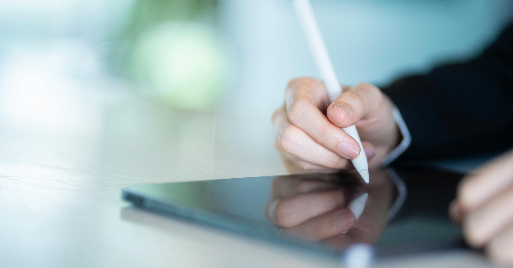 person drawing on tablet